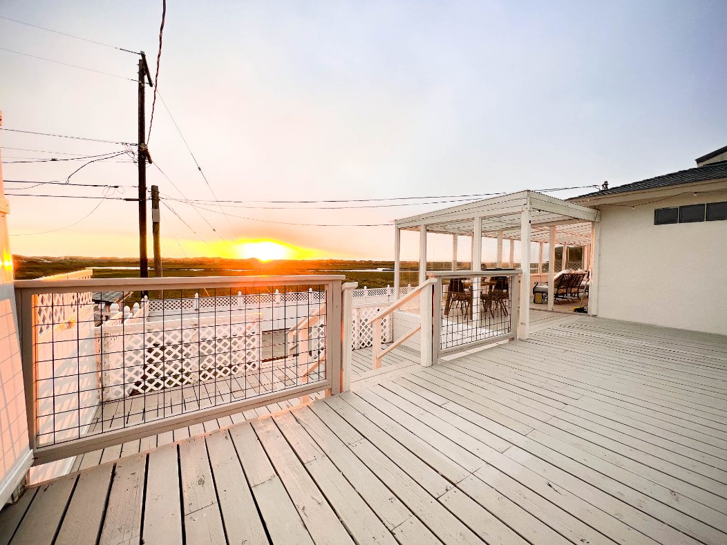 Sunset over the wetlands seen from the home's wraparound deck