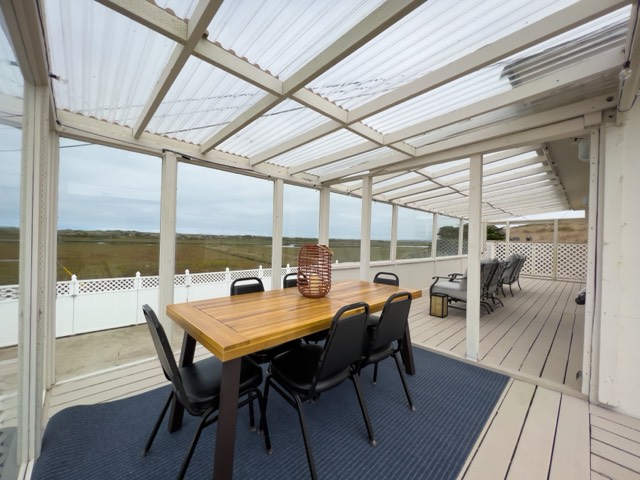 The sunroom dining area overlooking the dunes